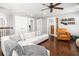 Cozy living room with a sectional sofa, hardwood floors, and a ceiling fan at 1427 Wando View St, Charleston, SC 29492