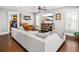 Bright living room with a comfortable sofa, TV, and a view through an open bedroom doorway at 1427 Wando View St, Charleston, SC 29492