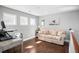 Comfortable upstairs landing spot with natural light, a sofa, and a desk at 1427 Wando View St, Charleston, SC 29492