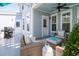 Enjoyable outdoor patio featuring wicker seating, a barbecue grill, and an inviting atmosphere for entertaining at 1427 Wando View St, Charleston, SC 29492