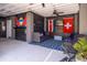Inviting outdoor patio features comfortable seating, a ceiling fan, and decorative flags for a relaxing atmosphere at 1427 Wando View St, Charleston, SC 29492