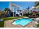 Backyard pool with turfed lawn, patio, brick fire pit, and lounge seating at 1427 Wando View St, Charleston, SC 29492