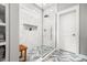 Modern shower featuring glass door, rain shower head, and herringbone tile at 1427 Wando View St, Charleston, SC 29492