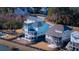 An impressive aerial view of lovely homes in a waterside community with manicured lawns at 1464 Stratton Pl, Mount Pleasant, SC 29466