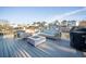 Large back deck featuring comfortable seating, a fire pit, and waterfront views at 1464 Stratton Pl, Mount Pleasant, SC 29466