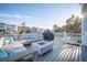 Spacious back deck with comfortable seating, fire pit, and scenic backyard views at 1464 Stratton Pl, Mount Pleasant, SC 29466