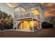 Exterior view of the deck and patio with outdoor seating on a spacious, lush lawn at 1464 Stratton Pl, Mount Pleasant, SC 29466