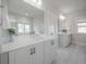 Modern bathroom featuring dual vanities, a large mirror, and ample natural light at 1464 Stratton Pl, Mount Pleasant, SC 29466