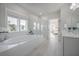 Bright bathroom with a large tub and a shower featuring white tile and modern fixtures at 1464 Stratton Pl, Mount Pleasant, SC 29466