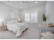 Comfortable bedroom with neutral tones, plantation shutters, and ample natural light at 1464 Stratton Pl, Mount Pleasant, SC 29466