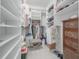 Walk-in closet features custom shelving, storage and room to sit while choosing your fit for the day at 1464 Stratton Pl, Mount Pleasant, SC 29466