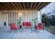 Cozy covered patio with outdoor seating, string lights, and lush greenery at 1464 Stratton Pl, Mount Pleasant, SC 29466