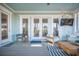 Welcoming covered porch featuring outdoor seating, ceiling fan and access to the interior at 1464 Stratton Pl, Mount Pleasant, SC 29466