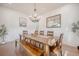 Bright dining area features wooden floors, chandelier, and a decorative mirror at 1464 Stratton Pl, Mount Pleasant, SC 29466