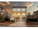 Exterior view featuring the elevated construction, front porch and spacious garages at 1464 Stratton Pl, Mount Pleasant, SC 29466