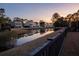 Beautiful neighborhood view of the water and luxurious coastal homes with inviting curb appeal at 1464 Stratton Pl, Mount Pleasant, SC 29466