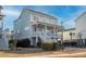 Lovely two-story home with a traditional design, highlighted by a cozy front porch and mature landscaping at 1464 Stratton Pl, Mount Pleasant, SC 29466