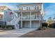 Inviting two-story house with a charming porch and a driveway, perfect for a Gathering looking for comfort and style at 1464 Stratton Pl, Mount Pleasant, SC 29466
