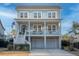 Beautiful two-story home boasting a classic design with a spacious front porch, perfect for relaxing outdoors at 1464 Stratton Pl, Mount Pleasant, SC 29466