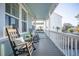 Relaxing front porch with comfortable rocking chairs, ideal for enjoying the fresh air and neighborhood views at 1464 Stratton Pl, Mount Pleasant, SC 29466