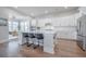 Modern kitchen with white cabinets, a large island, and stainless steel appliances at 1464 Stratton Pl, Mount Pleasant, SC 29466