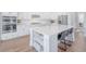Bright kitchen with stainless steel appliances, white cabinets, and seating at the island at 1464 Stratton Pl, Mount Pleasant, SC 29466