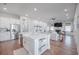 Bright, open kitchen with stainless steel appliances and a view of the living room at 1464 Stratton Pl, Mount Pleasant, SC 29466