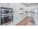 Modern kitchen featuring stainless steel appliances, stylish cabinets, and a double oven at 1464 Stratton Pl, Mount Pleasant, SC 29466