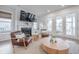 Bright living room showcasing a fireplace, comfortable seating, and a view of the outside at 1464 Stratton Pl, Mount Pleasant, SC 29466