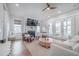 Cozy living room with a fireplace, ceiling fan, and sliding doors leading to the outside at 1464 Stratton Pl, Mount Pleasant, SC 29466