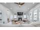 Bright living room with fireplace, ceiling fan, and sliding doors to an outdoor area at 1464 Stratton Pl, Mount Pleasant, SC 29466