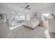 Airy main bedroom featuring a ceiling fan, bright windows, and an attached sitting room at 1464 Stratton Pl, Mount Pleasant, SC 29466