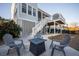 Backyard patio featuring a modern fire pit and comfortable outdoor seating area at 1464 Stratton Pl, Mount Pleasant, SC 29466