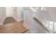 Bright staircase with wooden handrail and light wood floors adds a touch of warmth to this home at 1464 Stratton Pl, Mount Pleasant, SC 29466