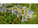An aerial view of a community with lush trees around the neighborhood and a serene lake at 1510 Windlass Way, Mount Pleasant, SC 29466