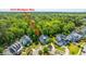 An aerial view showcases the property's location within a cul-de-sac and surrounded by lush trees at 1510 Windlass Way, Mount Pleasant, SC 29466