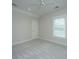 This bedroom is bright and spacious, featuring neutral carpeting, and a large window with white blinds at 1510 Windlass Way, Mount Pleasant, SC 29466