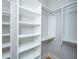 Walk-in closet featuring built-in shelving and hanging rods for ample storage space at 1510 Windlass Way, Mount Pleasant, SC 29466
