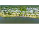 Scenic view of a tranquil lake surrounded by a charming community with manicured lawns and walkways at 1510 Windlass Way, Mount Pleasant, SC 29466