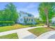 Charming two-story home with a welcoming front porch, blue siding, and mature landscaping at 1510 Windlass Way, Mount Pleasant, SC 29466