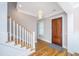 Entryway with hardwood floors, elegant staircase, and a stylish front door with beautiful trim details at 1510 Windlass Way, Mount Pleasant, SC 29466