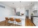 Modern kitchen with an island, stainless steel appliances, and sleek white cabinetry, perfect for cooking at 1510 Windlass Way, Mount Pleasant, SC 29466