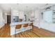 Open kitchen with white cabinetry, marble countertops, stainless appliances, and hardwood flooring at 1510 Windlass Way, Mount Pleasant, SC 29466