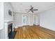 Cozy living room featuring a fireplace, hardwood floors, and French doors to the outside at 1510 Windlass Way, Mount Pleasant, SC 29466