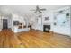 Open living space featuring hardwood floors, fireplace, built-in shelving, and seamless kitchen access at 1510 Windlass Way, Mount Pleasant, SC 29466