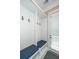Mudroom with white paneling, built-in storage, blue bench cushions, and tile flooring at 1510 Windlass Way, Mount Pleasant, SC 29466