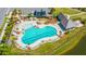 Aerial view of a community pool with lounge chairs, tables, cabanas, and palm trees at 1510 Windlass Way, Mount Pleasant, SC 29466
