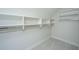 Walk-in closet with built-in shelving, rods, and carpeted flooring at 1510 Windlass Way, Mount Pleasant, SC 29466