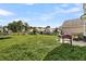 Large backyard space with a trampoline, playset, grill, and fenced perimeter at 1516 Mandarin Ct, Summerville, SC 29483