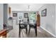 Bright dining area features a table with seating for six, with a doorway leading to the outdoor space, and decor at 1516 Mandarin Ct, Summerville, SC 29483